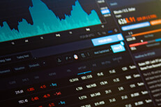 Laptop screen showing BTC Bitcoin stock price information