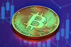 Bitcoin on reflective surface reflecting candlestick chart from monitor