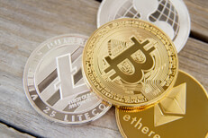 Free photo of a bitcoin, an Ethereum coin, a Litecoin, and a Ripple coin