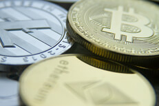 Free photo of a bitcoin, an Ethereum coin, and a Litecoin