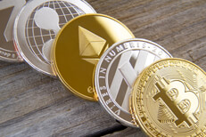 Bitcoin, Litecoin, Ethereum, Ripple, and Zcash coins on weathered wood planks