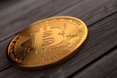 Gold Bitcoin on rough weathered planks Single gold Bitcoin placed on weathered wood planks with upper right soft light