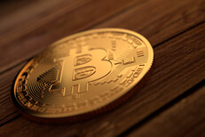 Gold Bitcoin on rough stained planks Single gold Bitcoin placed on stained wood planks with upper right soft light