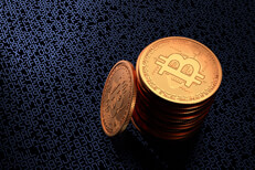 Stack of Bitcoins on blue digital code Stack of Bitcoins on dark background with blue illuminated digital key or blockchain