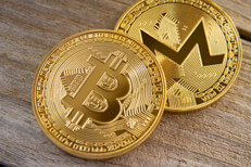 Bitcoin and Monero Bitcoin and Monero coin on wood background