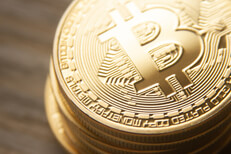 Close view from top of stack of bitcoins with soft back light