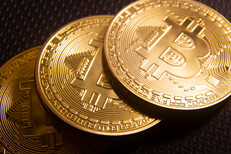 Three Bitcoins overlapped in a row