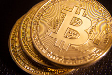 Stack of three Bitcoins Stack of three Bitcoins offset with depth of field blur