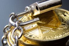 Hacked Bitcoins Stack of bitcoins wrapped in chains with unlocked padlock concept for insecure cryptocurrency