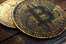 Tarnished Bitcoins Two Bitcoins with tarnish, corrosion, and patina on wood background