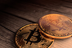Two Bitcoins close up on wood Two Bitcoins close up photo laid on old weathered wood planks