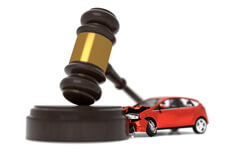 Auto insurance liability concept Car crashed into judge gavel concept photo for auto insurance liability