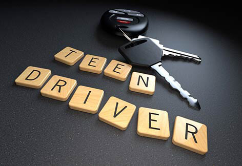 Teen driver auto insurance Teen driver wooden letters with car keys and key fob