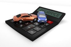 Two car collision on top of insurance calculator isolated on white background