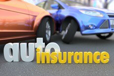 Two car accident blurred in background with words auto insurance in focus