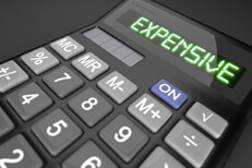 Expensive price concept Calculator with LCD showing Expensive to illustrate high cost concept