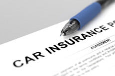 Close up of car insurance policy with blue ink pen