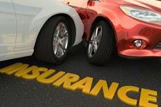 Car wreck insurance concept Two car accident with word Insurance in foreground