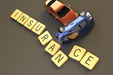 Car crash insurance concept Two car rollover accident sliding through wood insurance letters on dark background