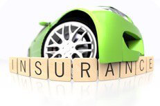 Green car insurance concept Green sport car bumper fish eye view over wood insurance letters