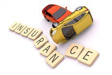 Car crash insurance concept Two car accident rollover sliding into insurance letters on white