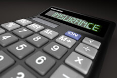 Insurance calculator on dark background low point of view