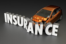 Compact car crashed into insurance letters concept Car insurance concept of car crashed into insurance word on dark background