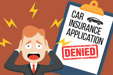 Car insurance application denied Car insurance application with large DENIED stamp with distressed man in foreground