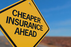 Cheaper insurance ahead road sign Yellow road sign reading Cheaper Insurance Ahead