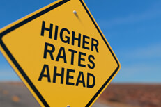 Higher Rates Ahead road sign Yellow road sign reading Higher Rates Ahead symbolizing auto insurance price increases