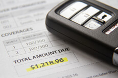 Insurance policy with keyless remote Auto insurance policy with highlighted amount due with vehicle keyless entry remote