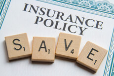 Insurance policy save Insurance policy with Scrabble letters reading SAVE concept for saving money on insurance