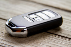 Keyless entry remote on wood Photo of a vehicle keyless entry remote on weathered wood planks