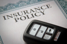 Keyless entry remote on policy Photo of a vehicle keyless entry remote on an insurance policy certificate