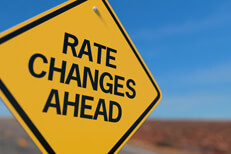 Rate Changes Ahead road sign Yellow road sign reading Rate Changes Ahead concept for fluctuations in car insurance rates