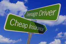 Street sign with arrows reading Teenage Driver and Cheap Insurance pointing in opposite directions