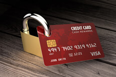 Padlocked credit card Photo of credit card with padlock locked through hole punched through card