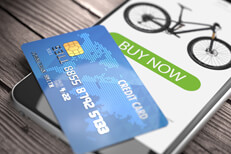 Credit card on mobile phone Mobile phone showing buy now button with credit card concept for mobile shopping