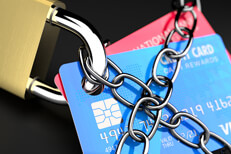 Credit lock service Close up photo of chains wrapping credit cards with padlock