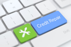 Credit repair with wrench Laptop keyboard with credit repair and wrench icon key