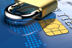 Padlock on blue credit card EMV Angled view of shiny padlock on blue credit card showing gold EMV chip