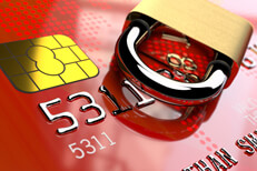 Red credit card with EMV and padlock Angled view of red credit card EMV chip with padlock lying on side