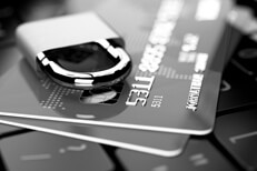 Black and white credit cards Credit cards on keyboard with padlock in black and white