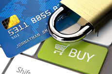 Secure online purchase concept Credit card and padlock on laptop keyboard with buy button and shopping cart icon