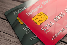 Top view two credit cards Top view of two credit cards on weathered wood plank background