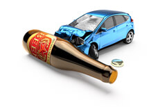 Blue car crashed into beer bottle Blue car crashed into beer bottle laying on side concept for drunk driving or DUI