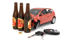 Car crashed into beer bottles Car crashed into three beer bottles with car keys on ground concept for DUI or drunk driving