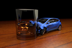 Car crashed into whiskey glass Drunk driving concept of small car crashed into glass of whiskey on bar table