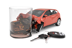 Red car crash with scotch glass with keys Driving impaired concept of car crashed into glass of scotch with keys and key fob