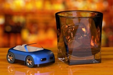 Toy car and whiskey glass on bar Glass of whiskey and toy car on bar with liquor bottles in background free DUI image